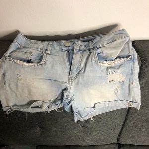 Distressed stretchy jean shorts